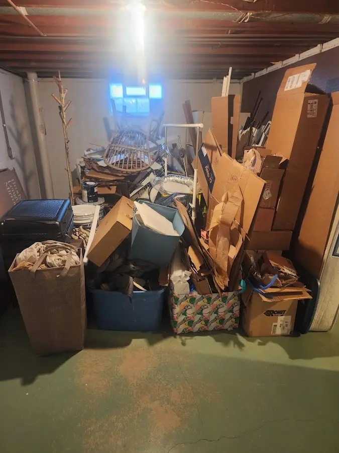 Roll-off dumpster container at job site for 2 Yard Dumpster Rental in Ellettsville